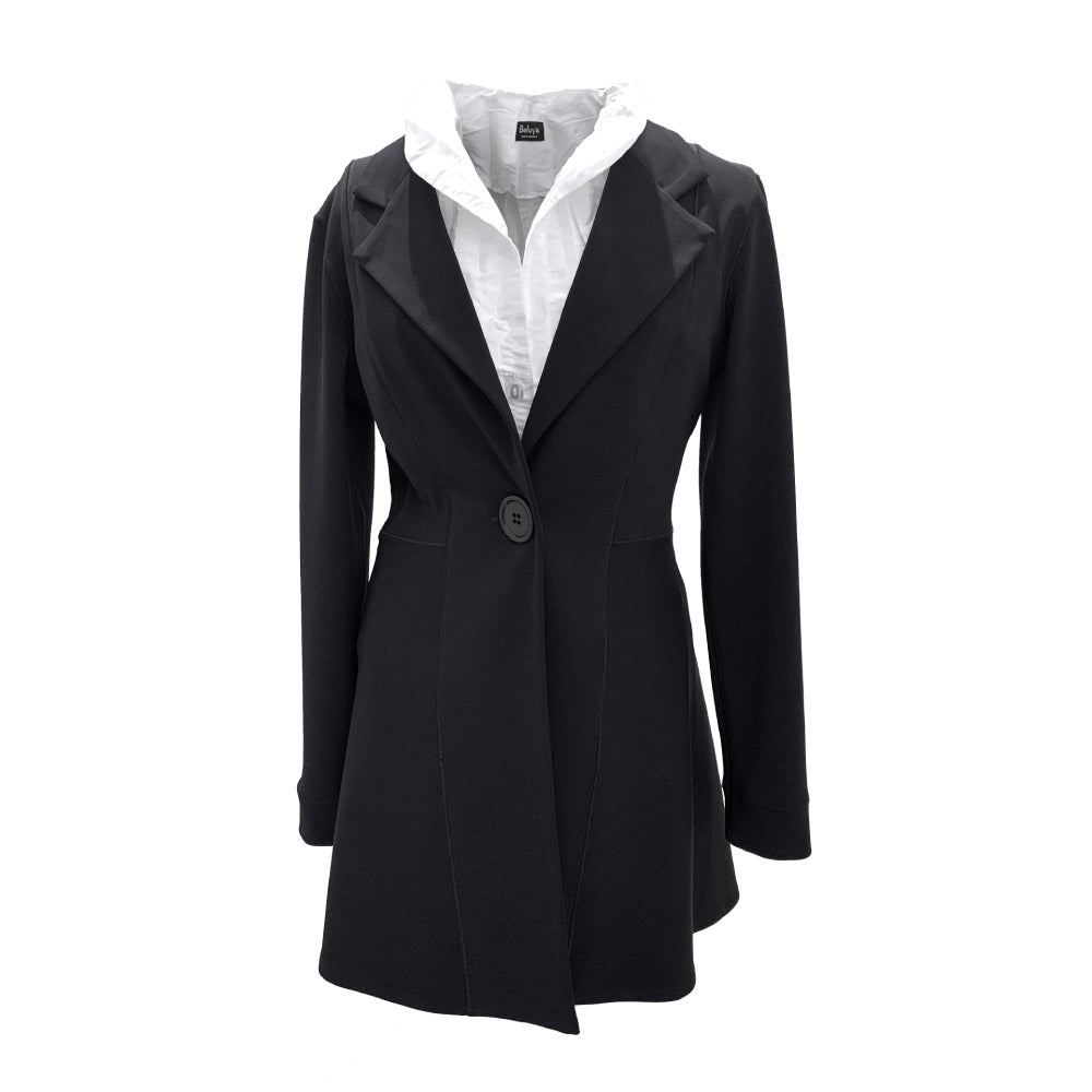 The shown jacket is black and has one big button to close in the waist area and has an elongating flowing fit. The jacket is paired with a white blouse with a shawl collar.