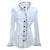 The blouse has a pure white body and a ruffle trim around the collar, along the button line and also as the trim of the sleeves. The body of the shirt is pure white and trim and buttons are in contrasting black.