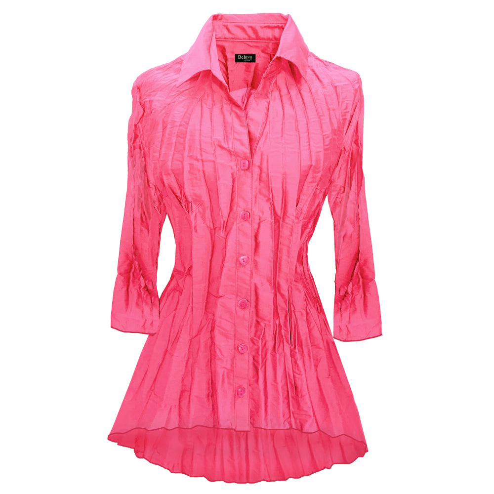 The blouse has a classic pointed collar and 3/4 sleeves. The tunic shape is longer on the back. Color Rose can be described as a bold warm floral pink. Buttons are of the same color.